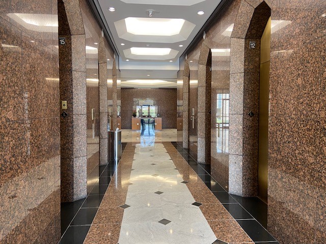 Lobby front desk past elevators